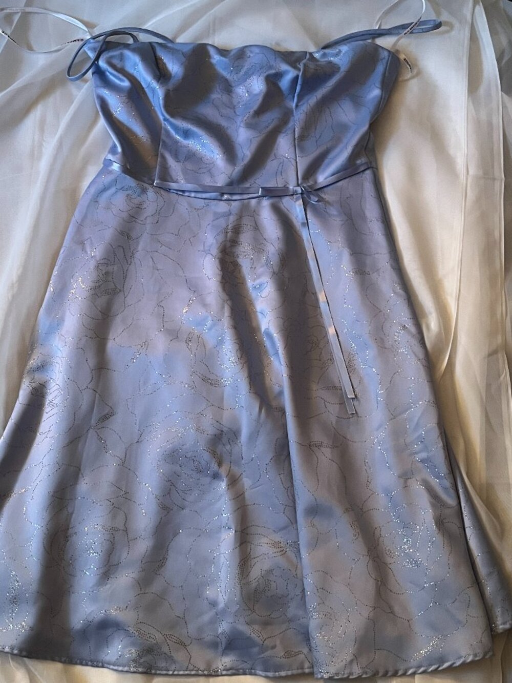 Beautiful Bleu Dress with Glitters, and a bow at the waist size 13 from Rampage.